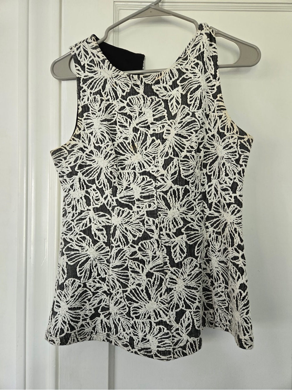 Black Sleeveless Lace-Overlay Blouse with White Floral Crochet